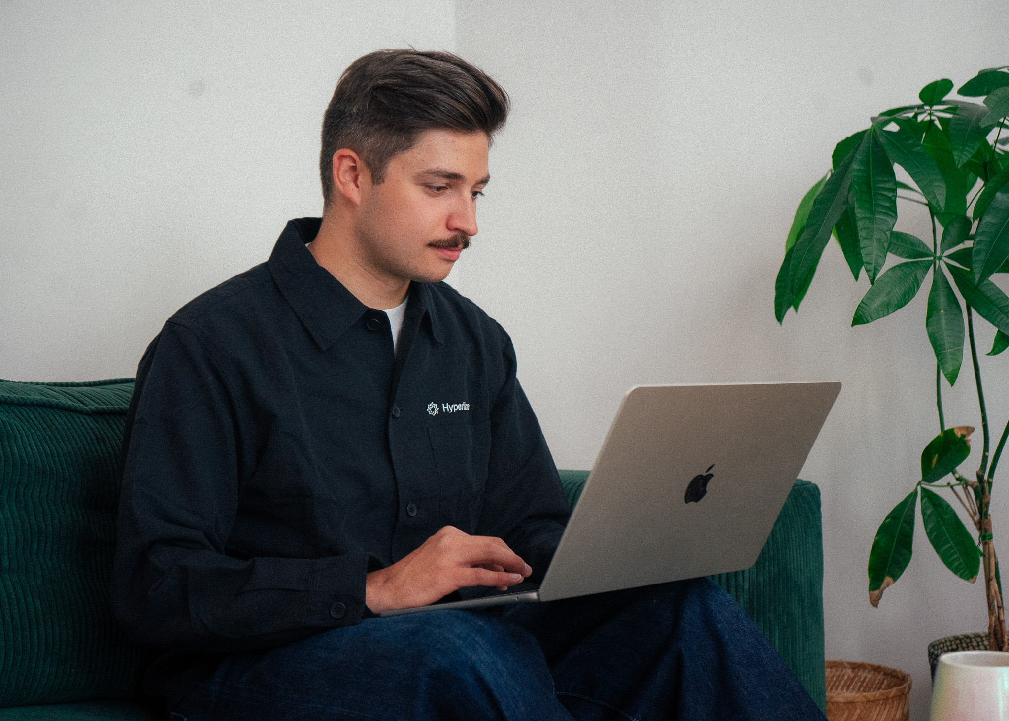 Thomas working on his laptop